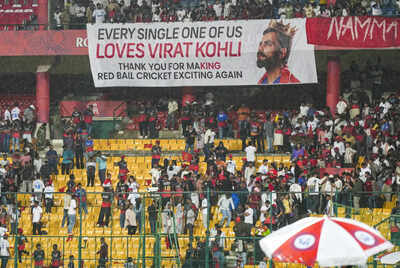 Bengaluru Fans of Royal Challengers Bengalurus Virat Kohli holds a large banne