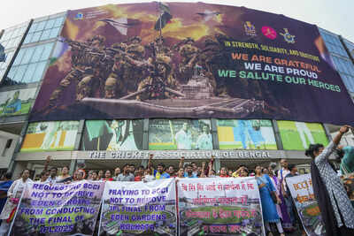 Kolkata Cricket lovers raise slogans as they gather in front of the Eden Garden