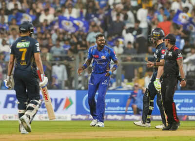 Mumbai Mumbai Indians Hardik Pandya with GT batters S Gill and J Buttler durin